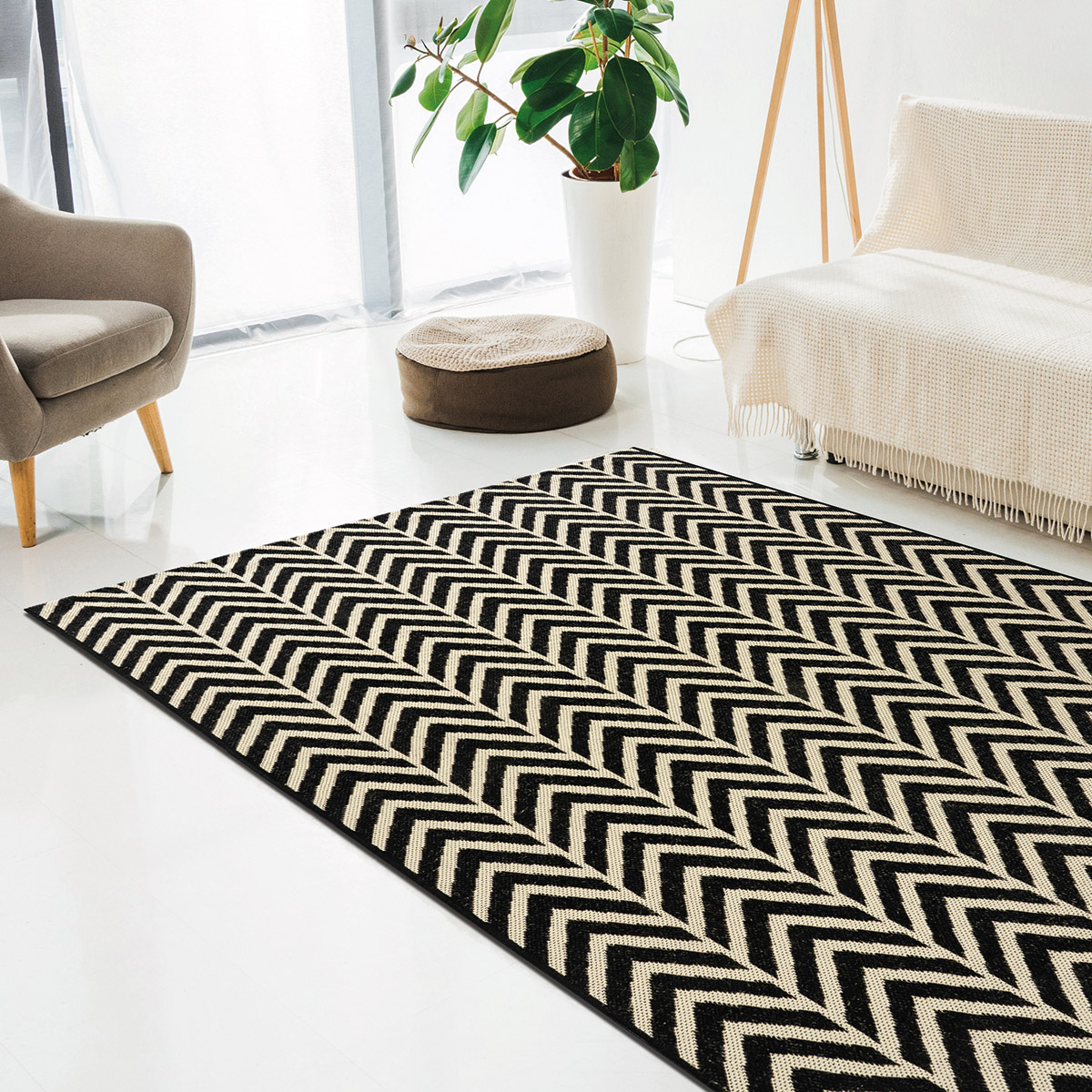 interior of modern living room with laptop, carpet and furniture